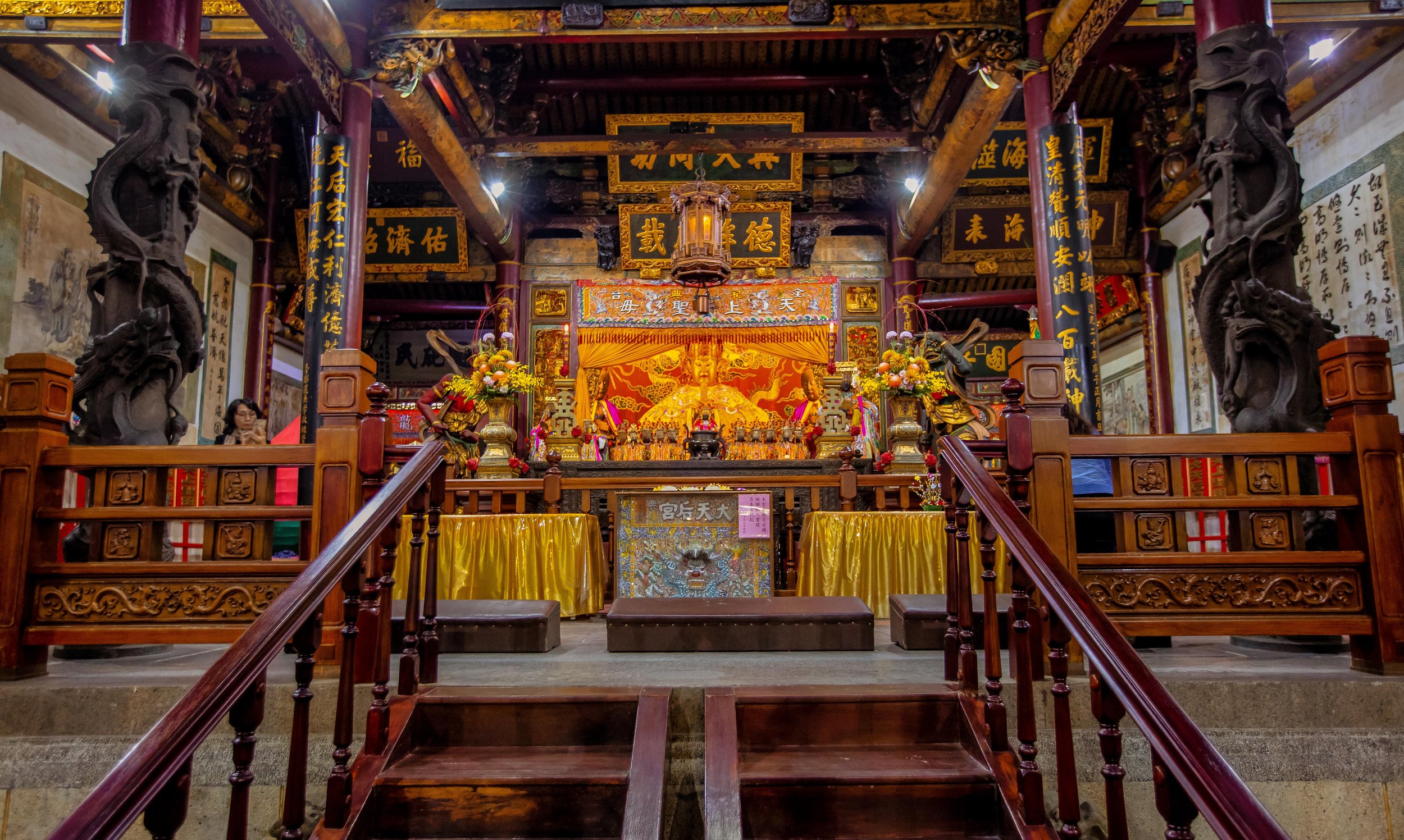 a shrine with incense and offerings around it